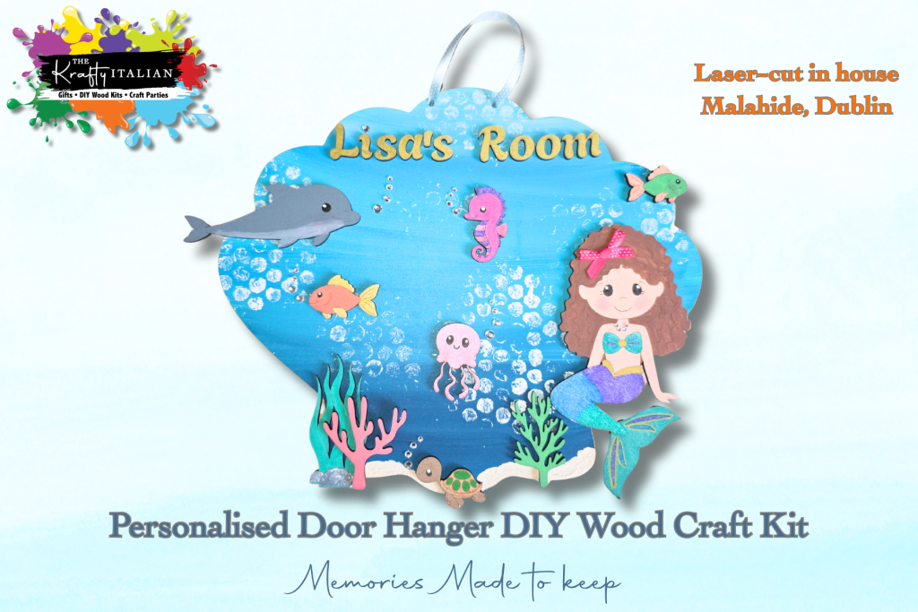 Elevate your décor with the Personalised Mermaid Door Hanger DIY Kit—a delightful blue seashell-shaped hanger featuring a mermaid, sea creatures, and custom “Lisa’s Room” text. This charming piece can be displayed on a door or as a shelf sitter and is perfect for adding a personal touch to your space. Create your own unique wooden craft with this easy-to-assemble kit from Malahide, Dublin—an ideal gift idea or creative project to complement any Halloween sweet basket display!.